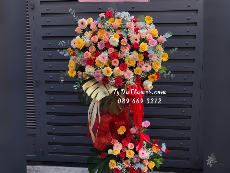 KCM03241466 KỆ HOA CHÚC MỪNG thiết kế tone màu đa sắc