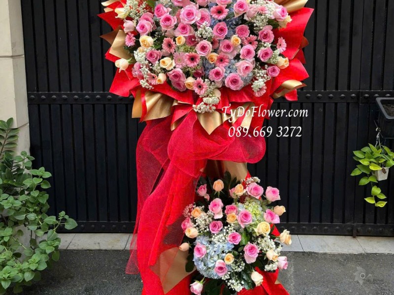 KCM0925725 KỆ HOA CHÚC MỪNG Thiết kế hoa hồng lạc thần, hoa hồng cam, cẩm tú cầu, đồng tiền mini trên nền giấy mỹ thuật cao cấp