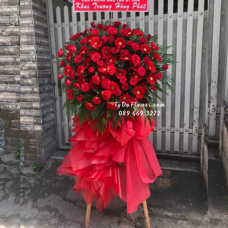 KCM0923998 KỆ HOA CHÚC MỪNG KHAI TRƯƠNG HỒNG PHÁT thiết kế Hoa Hồng Đỏ mix Đồng Tiền Đỏ