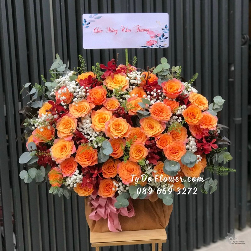 G11231173 GIỎ HOA CHÚC MỪNG KHAI TRƯƠNG thiết kế hoa hồng cam Spirit Roses, hoa lan đỏ