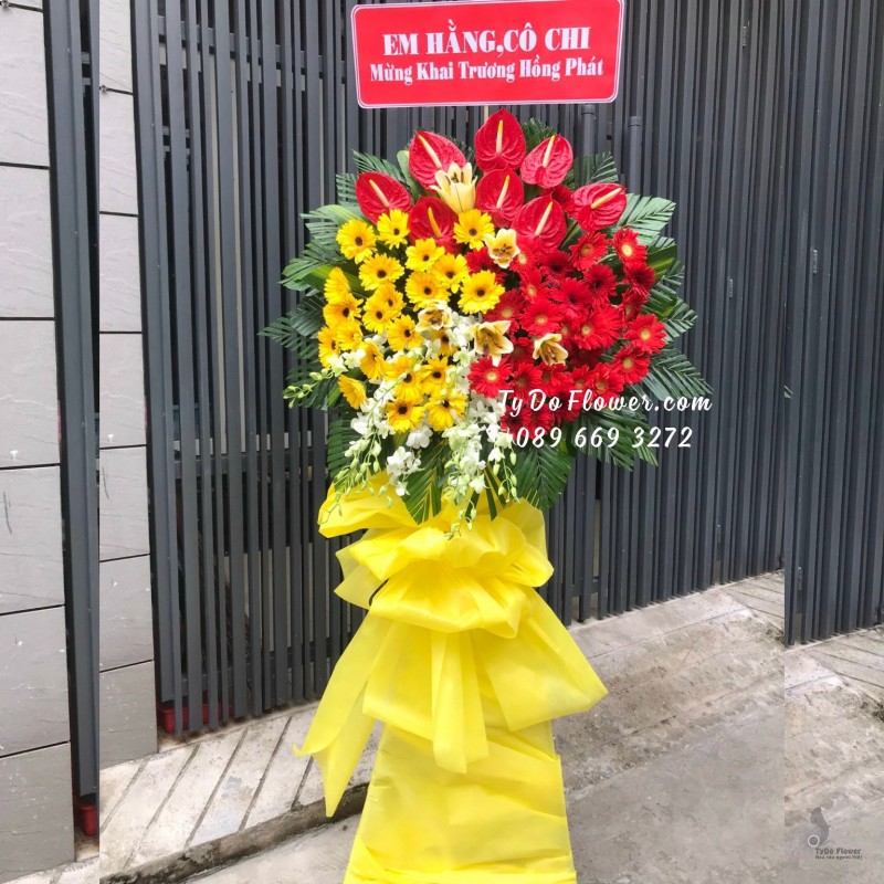 KCM12231224 KỆ HOA CHÚC MỪNG KHAI TRƯƠNG thiết kế tone màu đỏ vàng