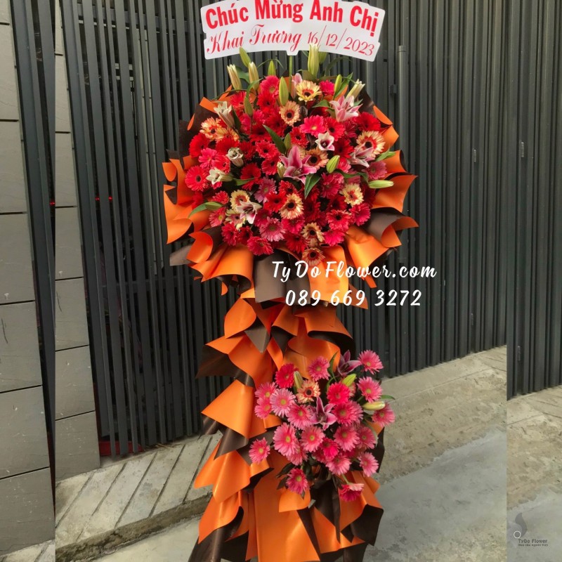 KCM12231235 KỆ HOA CHÚC MỪNG KHAI TRƯƠNG thiết kế tone màu đỏ cam