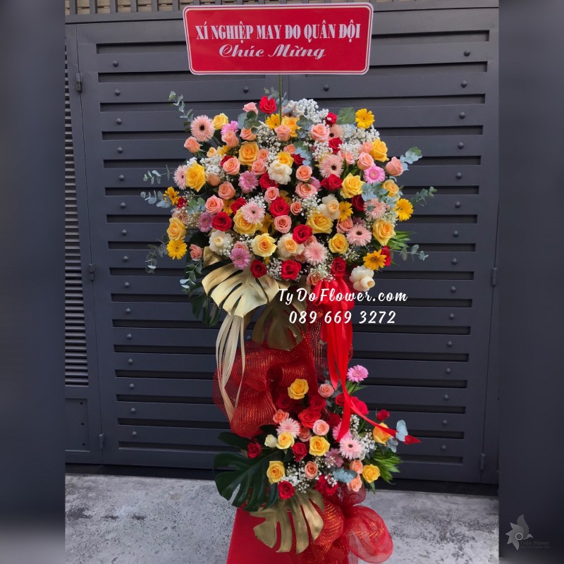 KCM03241466 KỆ HOA CHÚC MỪNG thiết kế tone màu đa sắc