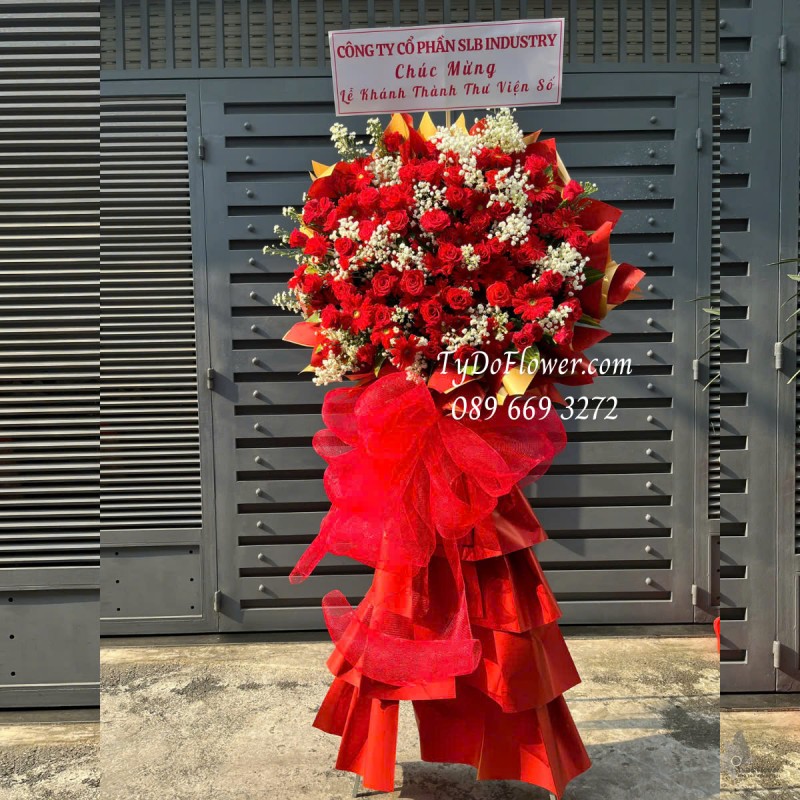 KCM0325195 KỆ HOA CHÚC MỪNG LỄ KHÁNH THÀNH Thiết kế gam màu đỏ, chủ đạo Hoa Hồng Đỏ, Đồng Tiền Đỏ, Baby Trắng