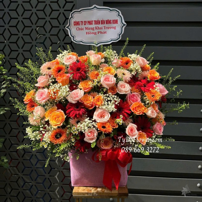 G0925675 GIỎ HOA CHÚC MỪNG KHAI TRƯƠNG HỒNG PHÁT Thiết kế hoa hồng cam Spirit. Pink Ohara, đồng tiền tua cam, đồng tiền đỏ