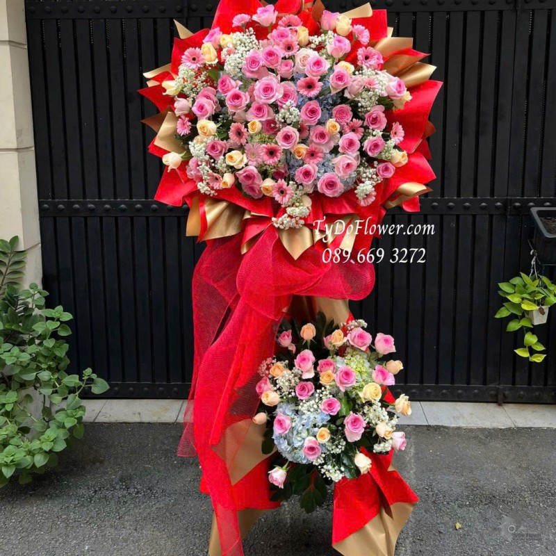 KCM0925725 KỆ HOA CHÚC MỪNG Thiết kế hoa hồng lạc thần, hoa hồng cam, cẩm tú cầu, đồng tiền mini trên nền giấy mỹ thuật cao cấp