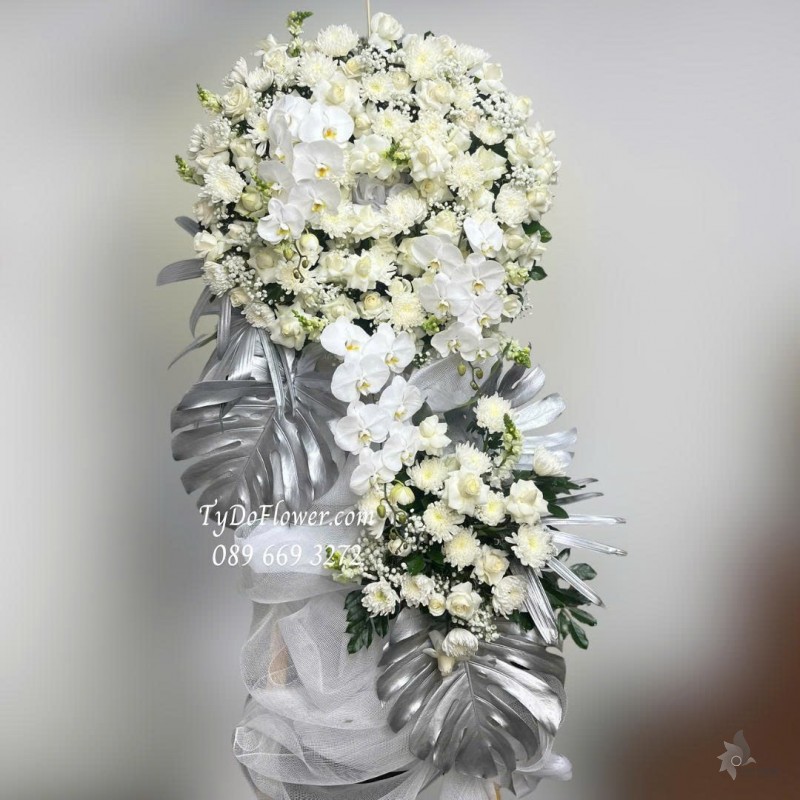 KCB0925749 KỆ HOA TANG LỄ VÒNG HOA CHIA BUỒN Hoa Kính Viếng Thiết kế 02 tầng, hoa hồng, lan hồ điệp, mõm sói, cúc, baby trắng