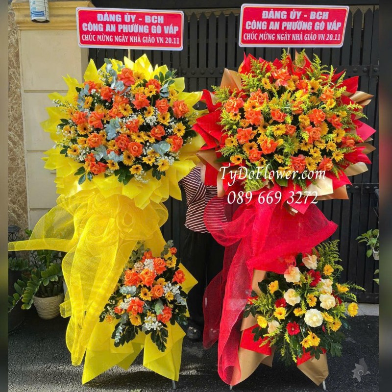 KCM0126029 ĐẶT TỪ 02 KỆ HOA CHÚC MỪNG Thiết kế hoa hồng cam, đồng tiền vàng
